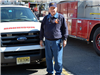 Fire Department Member Next to Emergency Vehicle