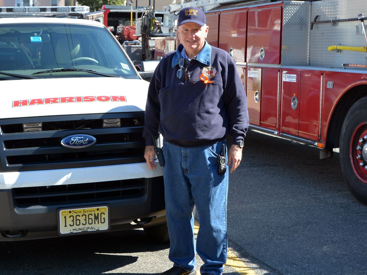 Fire Department Member Next to Emergency Vehicle